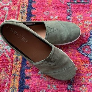 Tom’s olive green suede slip-ons